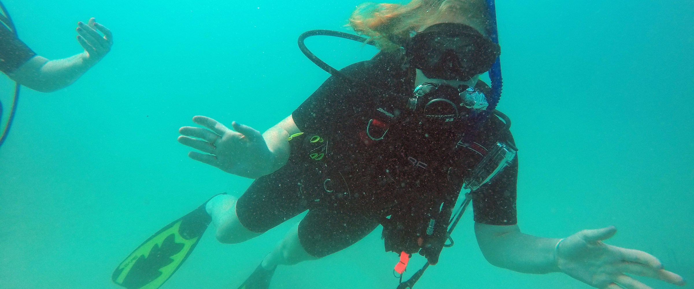 scuba diver waving