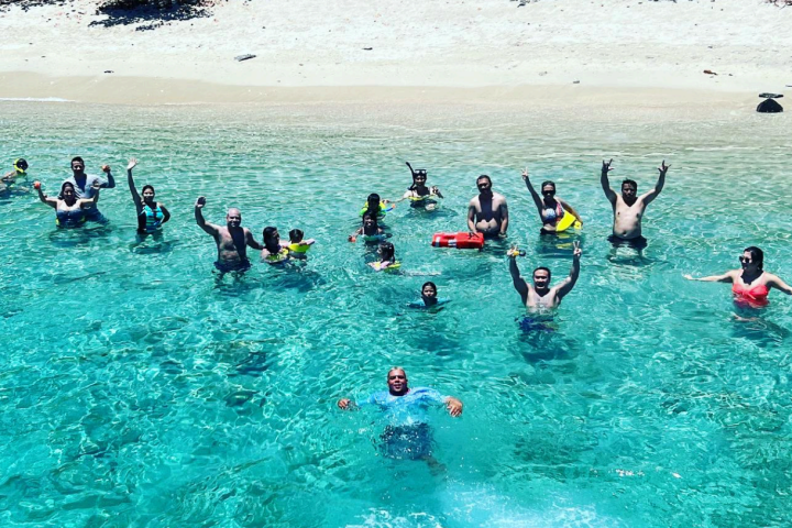 a group of people swimming in the water