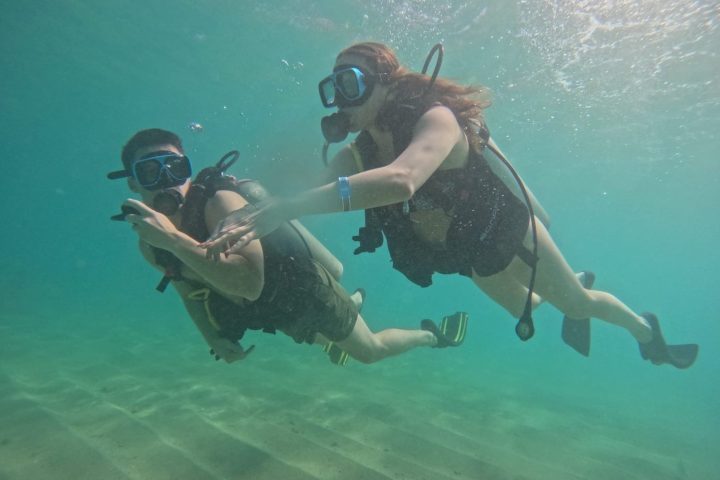 a person swimming in a pool of water