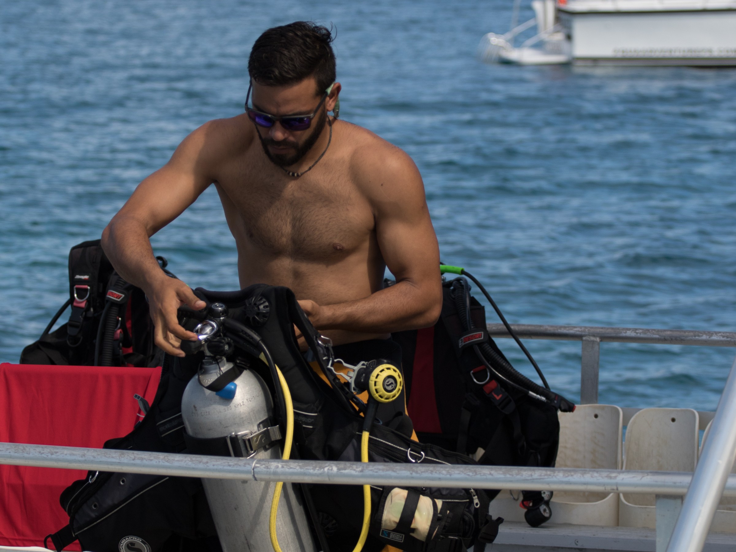 Man putting on scuba gear