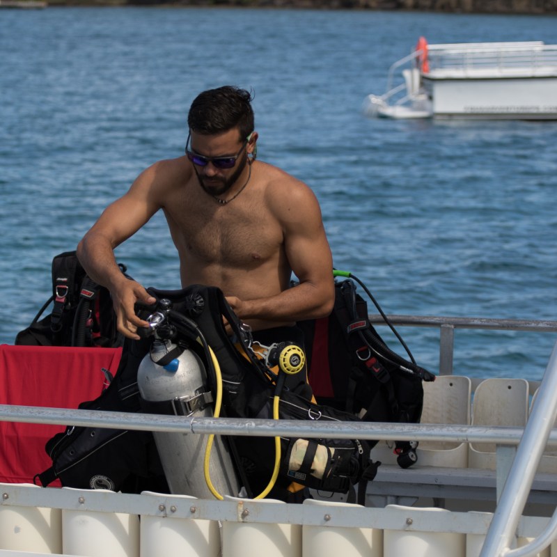 Man putting on scuba gear