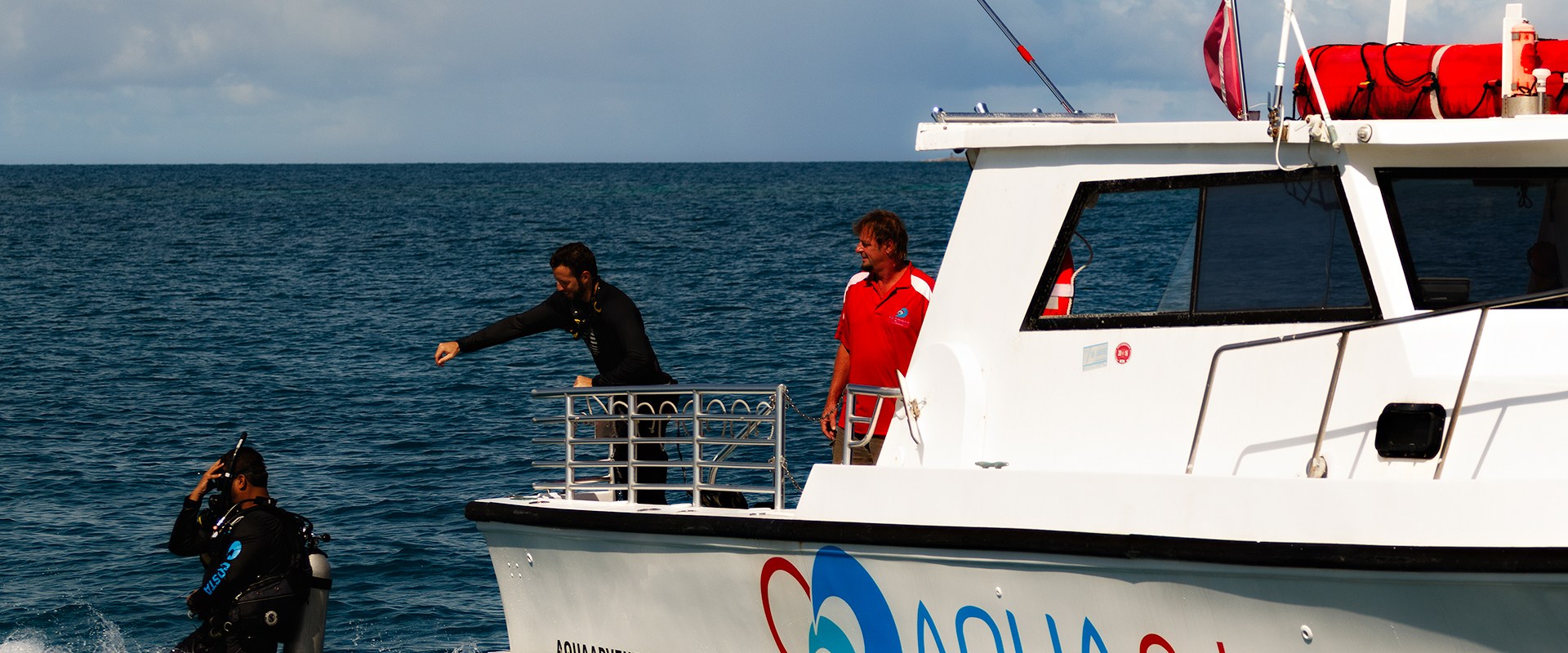 Boat Diver jumping into water from boat