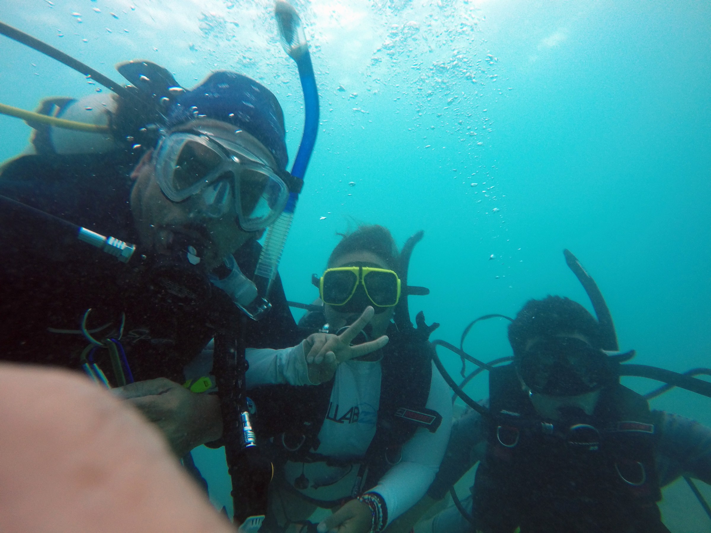 Three scuba divers taking a selfie