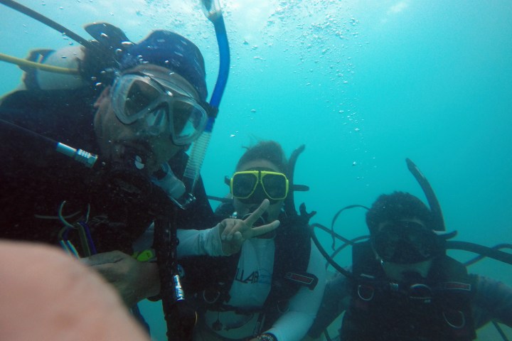 Three scuba divers taking a selfie