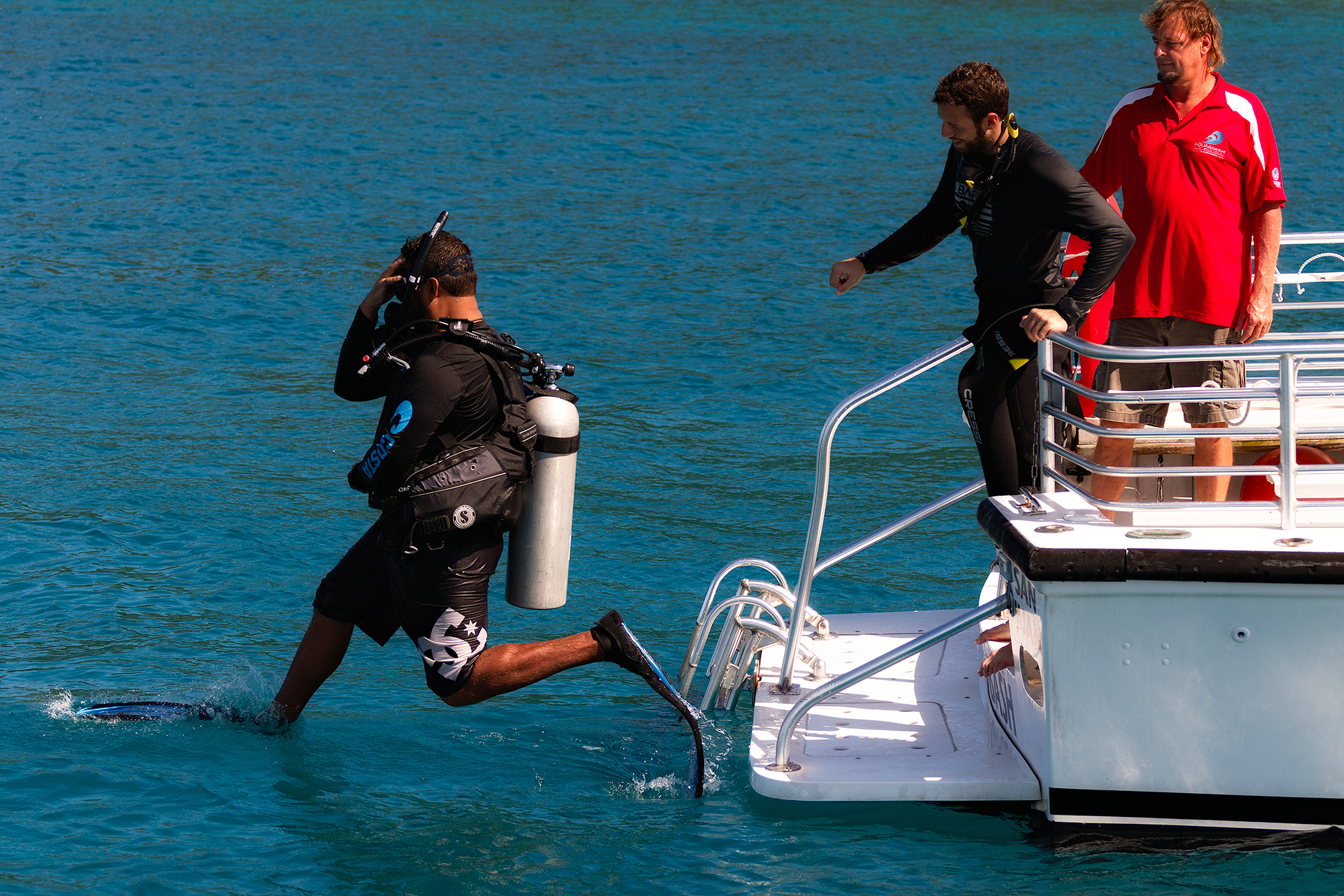 Scuba diver stepping into ocean
