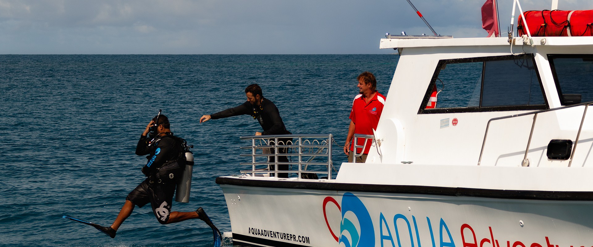 Boat Diver jumping into water from boat