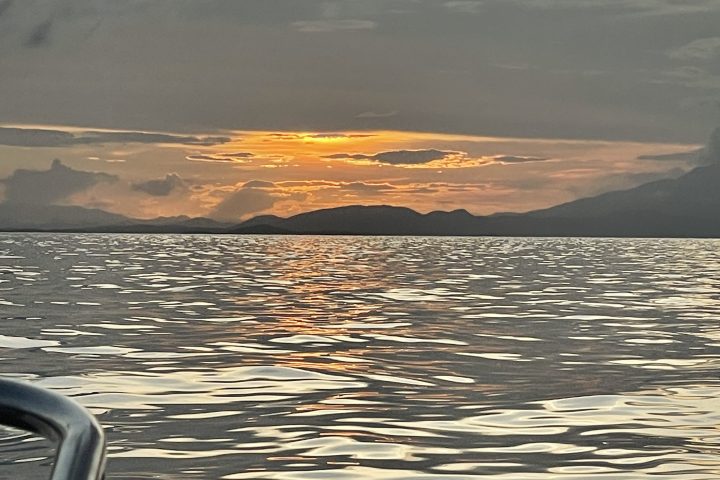 a sunset over a body of water
